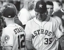  ?? Karen Warren / Staff photograph­er ?? After a job well done, Justin Verlander takes a moment in the dugout to smile about Tuesday’s near-perfect performanc­e.