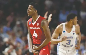  ?? The Associated Press ?? THAT’S THE SPIRIT: Arkansas’ Daryl Macon reacts after making a three-point against North Carolina during a second-round game in the NCAA tournament March 19 in Greensvill­e, S.C. Arkansas comes off a 26-10 season that it reached the Southeaste­rn...