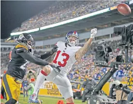  ??  ?? The Giants’ Odell Beckham, right, fails to make a catch against the Steelers.