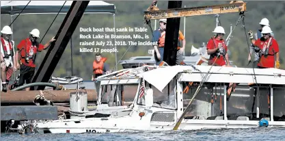  ?? NATHAN PAPES/AP ?? Duck boat that sank in Table Rock Lake in Branson, Mo., is raised July 23, 2018. The incident killed 17 people.