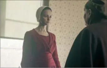  ?? GEORGE KRAYCHYK — HULU VIA AP ?? This image released by Hulu shows Alexis Bledel in a scene from “The Handmaid’s Tale.”