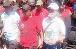  ?? (News24 @TeamNews24) ?? Julius Malema hand-in-hand with Carl Niehaus and ATM leader Vuyolwethu Zungula, as they make their way through the Pretoria CBD. The EFF leader said his party had an ‘appointmen­t with the streets’ but won’t be handing a memorandum to anyone.