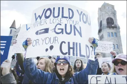  ?? AP PHOTO ?? Katie Wilson, 16, of Honesdale, Pa., along with fellow students and supporters of “March For Our Lives” rally against gun violence gather on Lackawanna County Courthouse Square in Scranton, Pa.