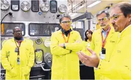  ?? SOURCE: LOS ALAMOS NATIONAL LABORATORY ?? U.S. Department of Energy Secretary Rick Perry, second from left, tours Los Alamos National Laboratory last year, accompanie­d by then-lab Director Charlie McMillan, second from right, and Jeff Yarbrough, right, the lab’s plutonium chief. The Energy...