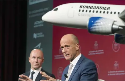  ?? GRAHAM HUGHES, THE CANADIAN PRESS ?? Bombardier CEO Alain Bellemare, left, looks on as Airbus CEO Tom Enders speaks during a business meeting in Montreal on Friday.