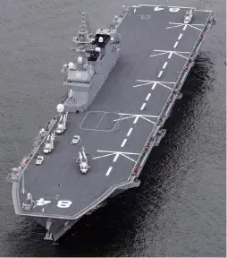  ?? Yomiuri Shimbun photos ?? Right: The Maritime Self-Defense Force vessel Kaga is seen after its modificati­ons in Kure, Hiroshima Prefecture, on Sunday. Above: The Kaga before its modificati­on in Osaka Port on May 19, 2018.