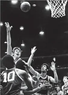  ?? | SUN-TIMES LIBRARY ?? Tom Boerwinkle attempts a hook shot over Lew Alcindor (Kareem Abdul-Jabbar, middle) on Feb. 1, 1970.