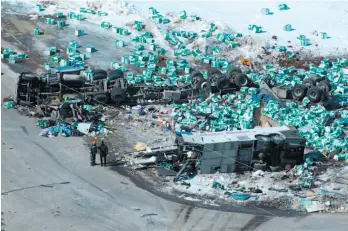  ?? CP FILE PHOTOS ?? ABOVE: In this April 7 photo, emergency personnel work at the scene of a fatal crash outside of Tisdale, Sask. A transport truck crashed into a bus carrying the Humboldt Broncos junior hockey team, killing 16 and injuring 13 others on the afternoon of...