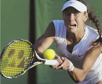  ?? AP PHOTO ?? LOOK OF A WINNER: Vitalia Diatchenko returns a shot during her victory against Maria Sharapova during action yesterday at Wimbledon.