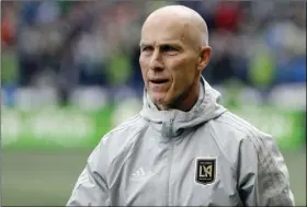  ?? AP PHOTO/TED S. WARREN ?? In this March 4 file photo, Los Angeles head coach Bob Bradley walks on the pitch before an MLS soccer match against the Seattle Sounders in Seattle. Six coaches begin their first full MLS season with a new team, a league record. Most notable is...