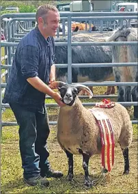  ?? Visit www. lochaberti­mes.co.uk for full show results ?? Above: John Nudds with his overall champion blackface gimmer Special. This was the ewe’s fifth winning outing for John.