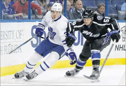  ?? AP PHOTO ?? FILE - In this March 16 file photo, Toronto Maple Leafs centre Auston Matthews (left) gets around Tampa Bay Lightning defenseman Jake Dotchin during the third period of an NHL game in Tampa, Fla.