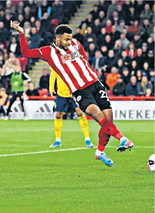  ??  ?? Point blank: Lys Mousset pokes home the only goal for Sheffield United to inflict misery on Arsenal’s Sokratis (far left) and Dani Ceballos