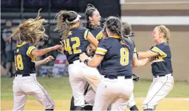  ?? [PHOTO BY SARAH PHIPPS, THE OKLAHOMAN] ?? Kiowa celebrates winning the Class B fast pitch softball state championsh­ip game Friday against Varnum at the FireLake Ball Fields in Shawnee.