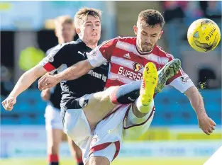  ??  ?? ■
Hamilton’s Scott McCann (right) in action against Craig Wighton.