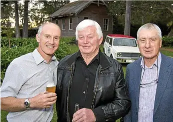  ??  ?? Operations manager Bart Brown toasts retired employees Ray Chappell and Mick Ahern (right) as Taylor’s Removals celebrates 100 years of business.