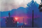  ?? FREDERIC J. BROWN AFP VIA GETTY IMAGES ?? Firefighte­rs battle the Bobcat fire in the Angeles National Forest on Monday.