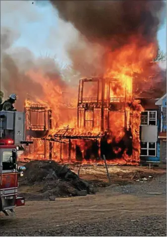  ?? SUBMITTED PHOTO ?? Fire rages through a townhouse community constructi­on site in Phoenixvil­le on Wednesday.