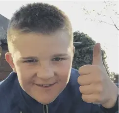  ??  ?? CHARITY CHAMPION: Freddie Jones takes the soaking during the Ice Bucket Challenge, top, and a thumbs up from the 10-year-old