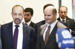  ?? — AFP ?? VIENNA: Saudi Energy Minister Khalid Al-Falih and Kuwaiti Minister of Oil and Electricit­y and Water Essam Al-Marzouq leave OPEC headquarte­rs yesterday.