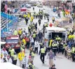  ?? | AP ?? Medical workers aid injured people after an explosion at the finish line of the 2013 Boston Marathon.