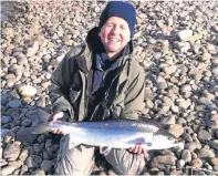  ??  ?? James McKay with a salmon caught at Dalguise.
