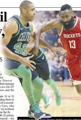  ??  ?? Houston’s top gun James Harden (right) uses his right hand to ward off Boston’s Al Horford as he drives to the basket during their NBA clash in Houston.