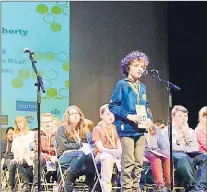  ?? LOUIS POWER/THE TELEGRAM ?? William O’flaherty, a Grade 5 student at Rennie’s River Elementary, is given a practice word before the bee begins Saturday.