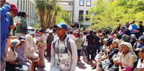  ?? Photo: Sue Maclennan ?? Staff join students in protest action on the quad below the main library at Rhodes University on Thursday 13 October. Police maintained a presence as Nehawu members sang with the #FeesMustFa­ll protested.
