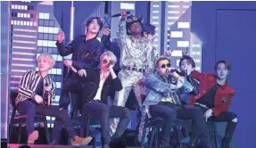  ?? MATT SAYLES/INVISION/AP ?? Lil Nas X, background center, and members of BTS perform “Old Town Road” at the 62nd annual Grammy Awards.