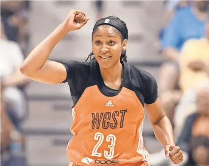  ?? JESSICA HILL, AP ?? Maya Moore, celebratin­g at Saturday’s WNBA All-Star Game, joined Carli Lloyd and Serena Williams in the national sports spotlight, indicating women’s sports are on the upswing.