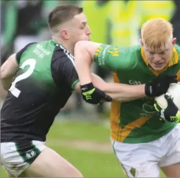  ??  ?? Centre-forward Daire Bolger taking on Blackhill Emeralds defender Ryan Courtney.