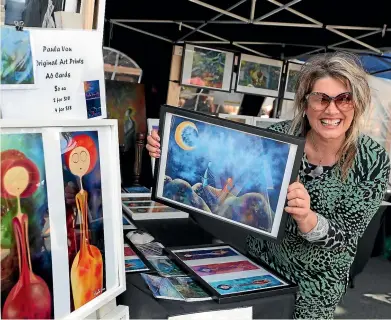  ?? JOHN BISSET/STUFF ?? Paula Vou of Paula Vou Art from Timaru shows off some works at the Geraldine Festival yesterday. It gets bigger today with about 200 stalls at the domain.
