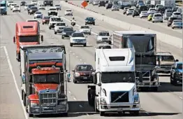  ?? AP/FILE ?? Highway safety advocates are worried that a government rule that would electronic­ally limit speeds of tractor-trailers could be scuttled or ignored by the Trump administra­tion.