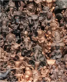  ??  ?? LEFT Various bronze figurines of Hindu deities and Buddhas in a souvenir shop in Kathmandu, Nepal