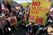  ?? AP FILE PHOTO ?? In this Oct. 18, 2017, file photo, protesters gather at a rally in Washington. The Supreme Court is allowing the Trump administra­tion to fully enforce a ban on travel to the United States by residents of six mostly Muslim countries. The justices say in...
