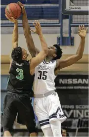  ?? Elizabeth Conley / Houston Chronicle ?? Rice forward Tim Harrison, right, blocks a shot by North Texas’ Roosevelt Smart in the first half, one of the few times the Owls were able to stop Smart.