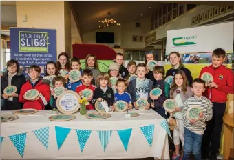  ?? Pic: ?? Grainne McLoughlin, Breeogue Pottery, with members of County Sligo Surf Club at an event to showcase the plaques that were co-created by Breeogue Pottery and County Sligo Surf Club, as part of the EU funded Craft Reach Project, led in Ireland by...