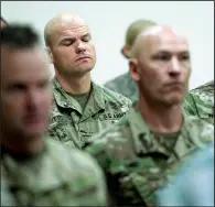  ?? AP/The Salt Lake Tribune/FRANCISCO KJOLSETH ?? Soldiers attend a news conference Sunday about the death of North Ogden, Utah, Mayor Brent Taylor. Taylor, who was training Afghan commandos, was shot to death by a member of the Afghan security forces.