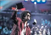  ?? Christophe­r Polk Getty Images ?? BRUNO MARS took home six Grammys at the January ceremony at N.Y.’s Madison Square Garden.