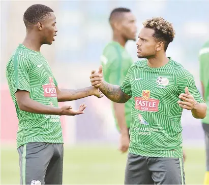  ?? Picture: Backpagepi­x ?? TEAM TALK. Phakamani Mahlambi and Kermit Erasmus deep in conversati­on during a Bafana Bafana training session in Durban this week.