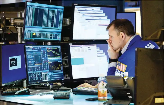  ?? Agence France-presse ?? ↑
A trader reacts on the floor of the New York Stock Exchange on Thursday.