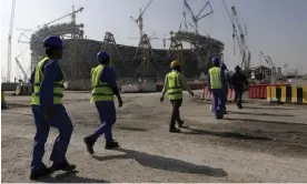  ?? Photograph: Hassan ?? Workers at Lusail stadium, which hosts the World Cup final.