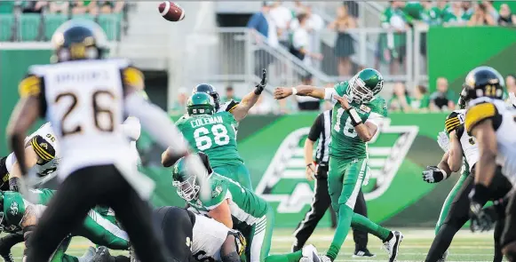  ?? BRANDON HARDER ?? Roughrider­s quarterbac­k Brandon Bridge shared passing duties with David Watford in Thursday’s game against the Tiger-cats.