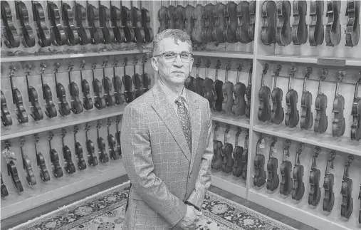  ?? Jerry Lara / Staff photograph­er ?? Abbas Selgi, who fled Iran in the 1990s, is owner of Terra Nova Violins. He learned his craft in secret, in a basement in Iran.