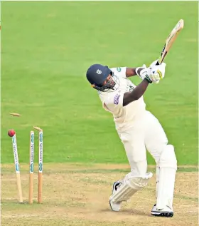  ??  ?? Bowled over: Fidel Edwards of Hampshire is dismissed by Tom Abell on day one