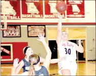  ?? RICK PECK/SPECIAL TO MCONDALD COUNTY PRESS ?? McDonald County’s Laney Wilson shoots a floater from the lane during the Lady Mustangs 55-36 loss to Neosho on Jan. 26 at MCHS.
