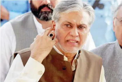  ?? File / Reuters ?? Ishaq Dar is seen after a party meeting in Islamabad recently.