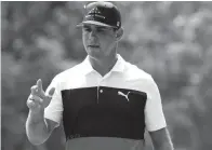  ?? AP ?? Gary Woodland reacts after a making putt on the fifth hole during the first round of the PGA Championsh­ip on Thursday in St. Louis.