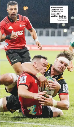  ?? PICTURE: Getty Images ?? Battler: Ryan Crotty of the Crusaders is tackled by Lachlan Boshier